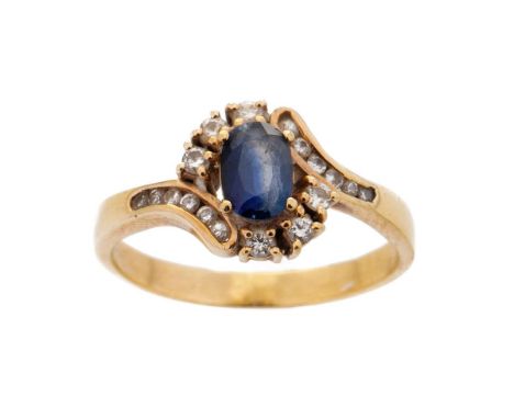 18ct yellow gold sapphire and diamond oval cluster ring. 3 Diamonds each side with an additional 6 diamonds in each channel o