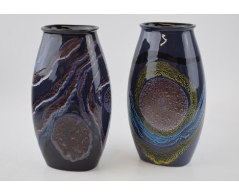 A pair of Poole Pottery 'Celestial' vases, 25cm tall.  In good condition with no obvious damage or restoration.