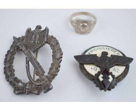 A collection of German military items to include a ring with skull and crossbones marked D.G.R.M and 800 for continental silv