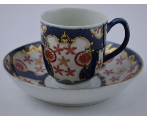 An 18th century Worcester porcelain Japan Star pattern on a blue scale ground cup and saucer, c. 1770.  In good condition, so