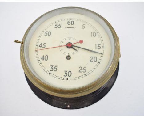 Marine bulkhead clock with military crowsfoot marked to the reverse A.P.727 A.C.O/R/12/59. Painted black outer case with bras