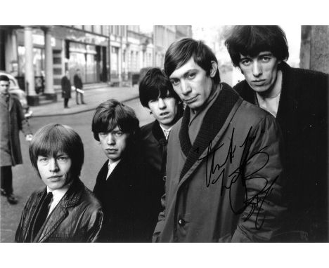 Charlie Watts signed 12x8 black and white photo pictured with his fellow Rolling Stones band members. Good Condition. All aut