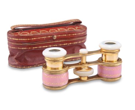 A PAIR OF CARTIER ENAMELLED GILT OPERA GLASSES, mark for Louis Cartier, early 20th Century, the barrels with pink enamel over