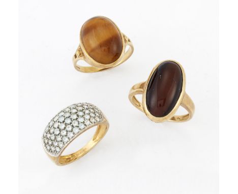 THREE 9 CARAT GOLD GEM-SET RINGS, including A TIGER'S EYE RING; A CHATOYANT STONE RING; and A PAVÉ-SET RING. (3) Birmingham h