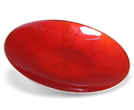 A NORWEGIAN STERLING SILVER AND RED ENAMEL DISH, by J. Tostrup, circular, the red enamel of segmented pattern. 9.5cm diameter