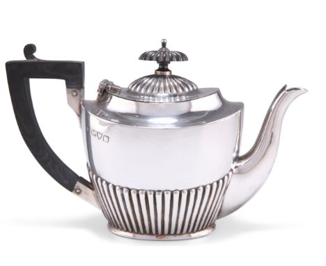 A GEORGE V SILVER BACHELORS TEAPOT,&nbsp;by George Nathan &amp; Ridley Hayes, Chester 1910, oval, the body fluted to the lowe