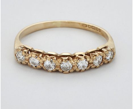 A 9 CARAT GOLD DIAMOND HALF HOOP RING, seven round brilliant-cut diamonds in claw settings. Estimated total diamond weight 0.