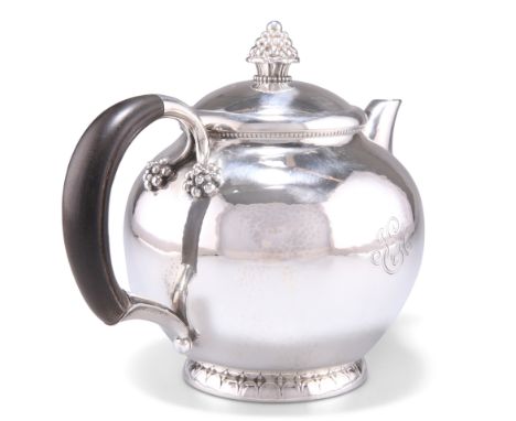 A DANISH STERLING SILVER TEAPOT, CIRCA 1930,&nbsp;by Georg Jensen, no. 32C, globular form with ebony handle, the detachable d