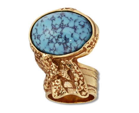 YVES SAINT LAURENT - A GILT-METAL AND PASTE ARTY RING,&nbsp;set with a simulated turquoise cabochon. Maker's mark, Ring size 