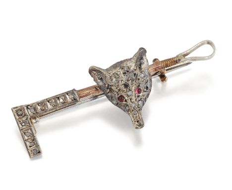 A NOVELTY DIAMOND AND RUBY FOX AND CROP BROOCH, a fox's head with ruby cabochon eyes. 1.5cm by 4.2cm, 3.5 gramsCONDITION REPO