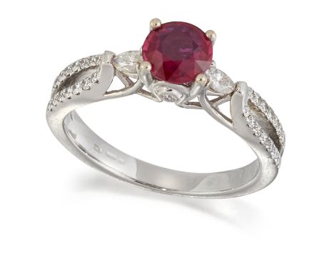 AN 18 CARAT WHITE GOLD RUBY AND DIAMOND RING,&nbsp;a round-cut ruby between marquise-cut diamonds, to diamond-set under-bezel