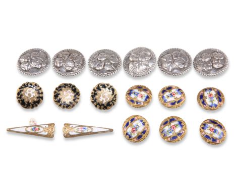 A SET OF SIX EDWARDIAN SILVER BUTTONS, by Levi &amp; Salaman, Birmingham 1902, embossed with cherub heads, within rope border