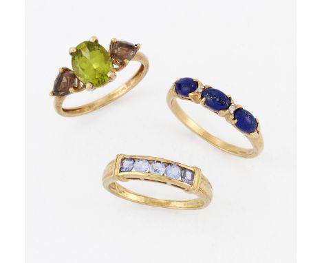 THREE 9 CARAT GOLD GEM-SET RINGS,&nbsp;including&nbsp;A PERIDOT AND SMOKY QUARTZ THREE STONE RING; A LAPIS LAZULI AND DIAMOND