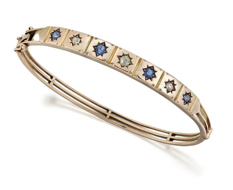 A VICTORIAN SAPPHIRE AND DIAMOND BANGLE,&nbsp;alternating star-set oval-cut sapphires and old-cut diamonds, to a tapering thr