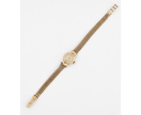 A LADY'S 9 CARAT GOLD OMEGA BRACELET WATCH,&nbsp;circular champagne dial with gilt Arabic/baton index and gilt sword hands, c