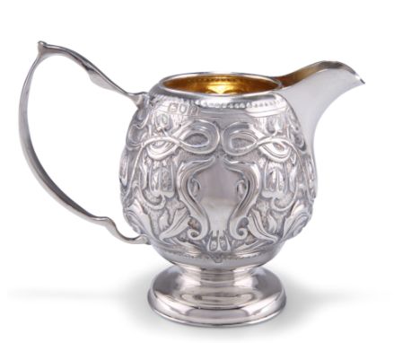 AN ART NOUVEAU SILVER CREAM,&nbsp;by William Hutton &amp; Sons Ltd, London 1901, boldly chased with stylised flowers and sinu