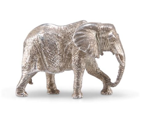 A STERLING SILVER ELEPHANT,&nbsp;by Patrick Mavros, Zimbabwe, modern, the miniature adult model with tusks realistically cast