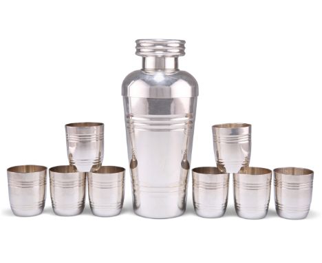 A CONTINENTAL COCKTAIL SHAKER AND EIGHT CUPS, the cocktail shaker of shouldered tapering form with reeded bands and cap, the 