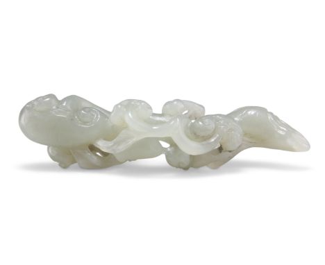 A CHINESE JADE CARVING OF SCROLLING LINGZHI FUNGUS. 2.5cm by 8.5cmCONDITION REPORTGood overall condition.&nbsp;