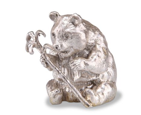 AN ELIZABETH II SILVER GIANT PANDA, maker's mark indistinct, London 1994, the model cast holding a bamboo shoot. 3cm high, 2.