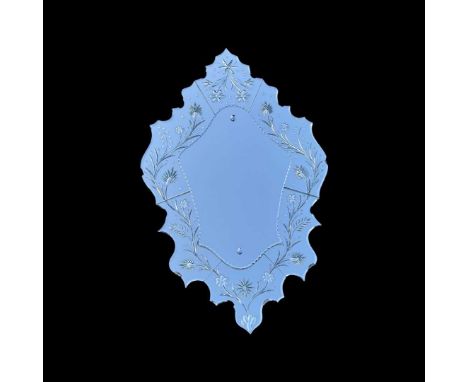A Venetian style mirror, shield shaped with floral border100 x 60 cm