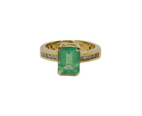 18ct Gold Emerald And Diamond Ring stamped with 18ct gold hallmarks a beautiful light green emerald and diamond shoulderCondi