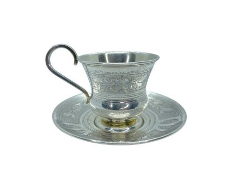 A Russian Silver Teacup and Saucer, Moscow 1883, 92g.Moscow 1883, 92g.Engraved and engine turned decoration.Saucer 9.5 cm x C