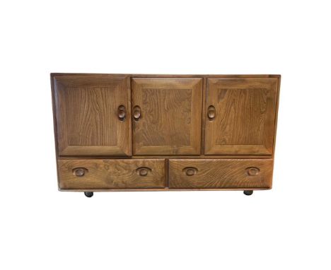 1970's Ercol Elm Sideboard, double cupboard and single cupboard with cutlery drawer, over two drawers130 cm widthQty: 1