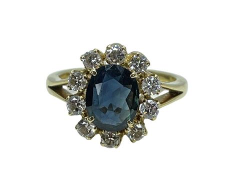 18ct Gold Sapphire And Diamond Cluster Ring beautiful blue oval sapphire and diamond, Size MCondition report: excellent condi