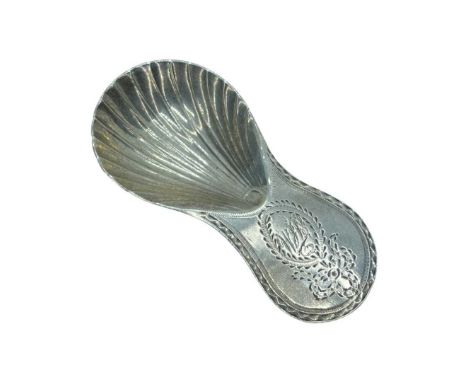 Georgian Silver Caddy Spoon. Charles Hougham, London 1785. 14 g. Scalloped bowl and bright cut decoration to handle.Length 7.