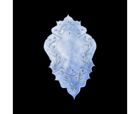 A Venetian style mirror, shield shaped with floral border110 x 60 cmQty: 1