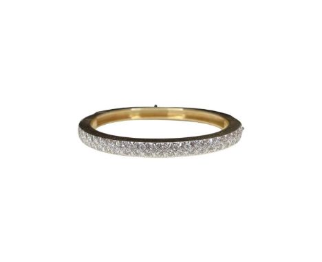 A diamond set hinged bangle in 14ct gold, diamond weight approx 2ct. A modern cut down setting of 44 diamonds in white gold s