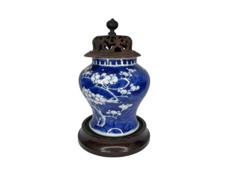 A blue and white Chinese Kangxi blue moon prunas vase (marked to base) on wooden stand.11 cm highQty: 1