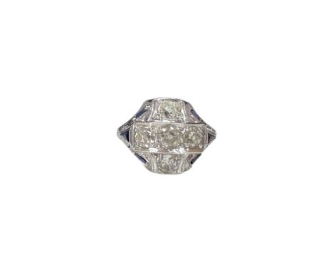 An unusual 18ct white gold old cut diamond ring, 5 diamonds set off by 6 calibre cut sapphires, diamond weight approx 1.65ct,