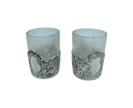 A Pair of Russian Silver Glass Holders, c1900, 42g.Pierced and embossed scroll decoration. With Austro-Hungarian import marks