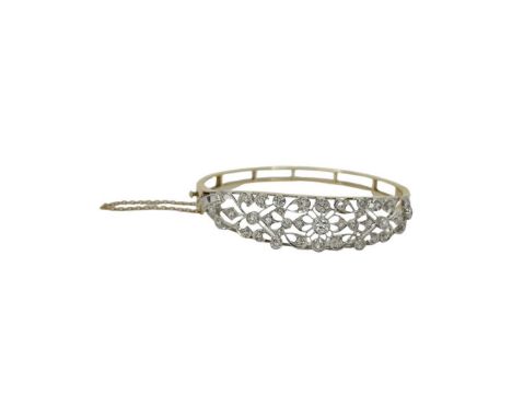 A open work filligree diamond set hinged bangle, diamond weight approx 2.50ct, total diameter 6cm, old cut diamonds mounted i
