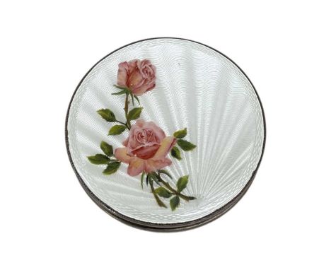 Circular Silver and Guilloche Enamel Compact. Birmingham 1956, 84 g. Engine turned, white enamel with pink rose stems.7.2 cms