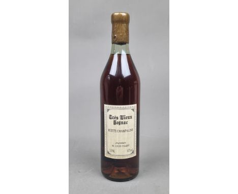 M. Louis Vallet Tres Vieux Petit Champagne Cognac Bottled 1986. Bottle Number 428 of 576.   Label reads "Aged in oak barrels 