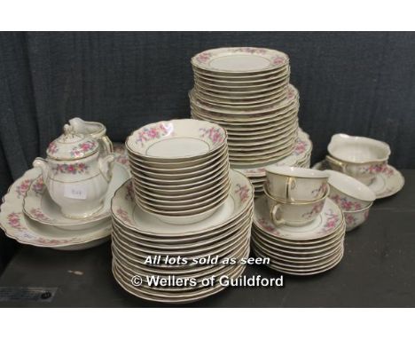Haviland Limoges porcelain part dinner service with floral borders, comprising a large oval serving plate and smaller example