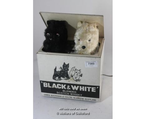 Black &amp; White scotch whisky advertising dog-in-the-box, the lid opening to reveal two terriers rising up and barking, mad