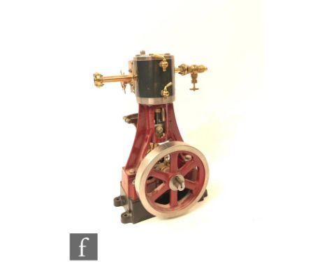 A Stuart single cylinder vertical marine engine, painted in black and maroon, with oscillating single piston, no plinth, heig