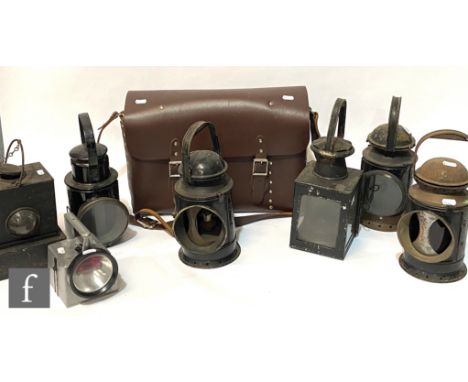 A collection of railway hand lamps to include LMS No 61764 (repaired), two BR (W), another GWR, two square BR (M) lamps, a la