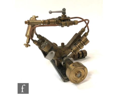 A marine type engine with&nbsp;4 double acting opposing oscillating cylinders, constructed from brass, height 14cm. 