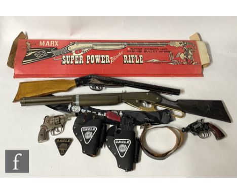A Lone Star Man From UNCLE automatic pistol, together with holster and pin badge, with a boxed Marx Super Power Ricochet Rifl