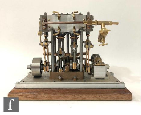 A scratch built twin cylinder vertical marine engine, constructed in steel and brass and raised to a chamfered mahogany plint