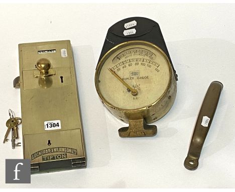 A brass penny in the slot railway door lock by Lockerbie &amp; Wilkinson Tipton, height 32cm, a brass carriage door handle an