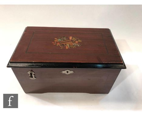 A Britannia disc musical box playing 5 inch discs, lever operation, transfer detail to lid and underside and eleven discs, wi