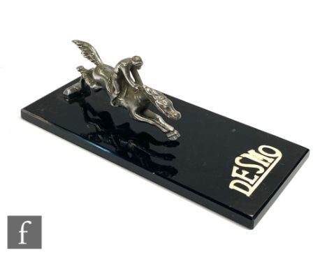 A Desmo horse and jockey mounted as a Desmo promotional desk stand, width 20cm. 