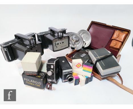 A collection of Polaroid and Shackman items to include three passport cameras, various Polaroid land cameras, together with c