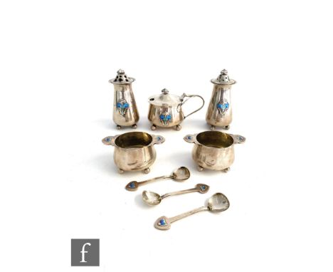 An Art Nouveau hallmarked silver five piece cruet set, each raised on four ball feet and detailed with floral enamelled decor